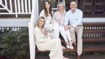 Ariarne, her younger sister Mia and parents Steve and Robyn at the family home they are now selling. Pic: Peter Brew-Bevan/Australian Women's Weekly