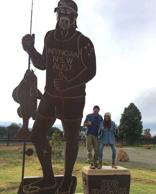 Making new friends: Adam Eckersley and Brooke McClymont meet Nyngan's Big Bogan on the Friday of their Winter Warm Up Tour. Photo: CONTRIBUTED.