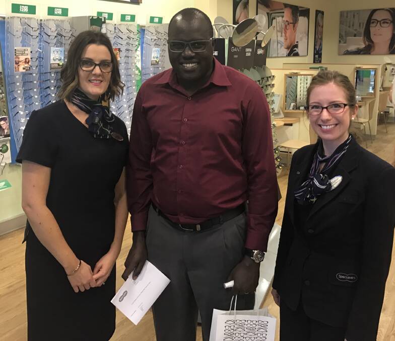 20/20: Specsavers dispensing director Claire Curtin and Optometrist Yvonne O'Sullivan with LCFU's Moses Goire. Photo: Contributed