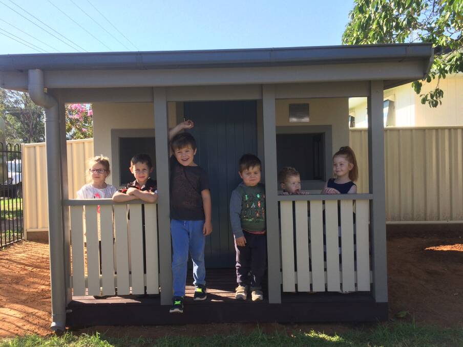 DELIGHTED: Nyngan preschoolers play in their new cubby house donated by South Dubbo Rotary. Photo: CONTRIBUTED.
