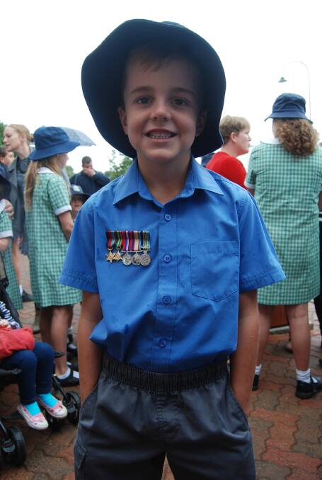MARCHING WITH MEDALS: St Joseph's Student Jimmy Smith wears his great grandfathers medals with pride during the Anzac March on Tuesday. Photo: GRACE RYAN. 
