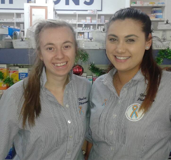 SHOWING SUPPORT: Nyngan pharmacy's Catherine and Kayla show their support for IDPWD on Friday, December 2. Photo: CONTRIBUTED.
