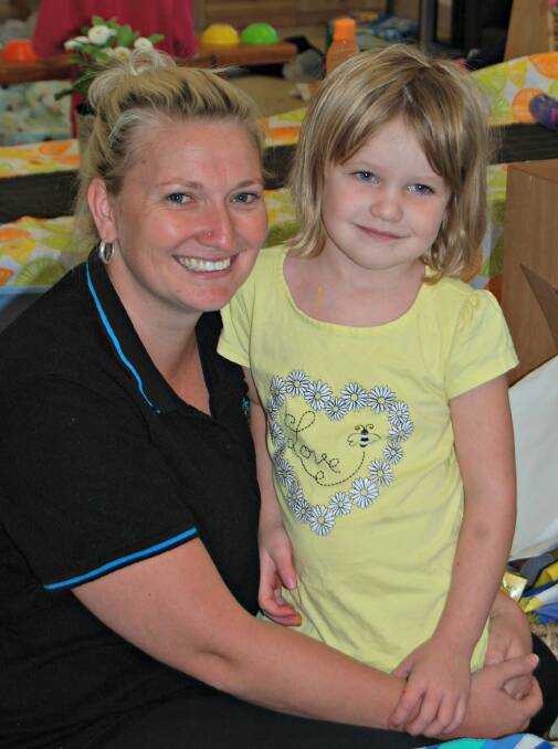 ALL SMILES: Niccy McJanet with Mackenzie at the Early Learning Centre on Monday. Photo: GRACE RYAN. 