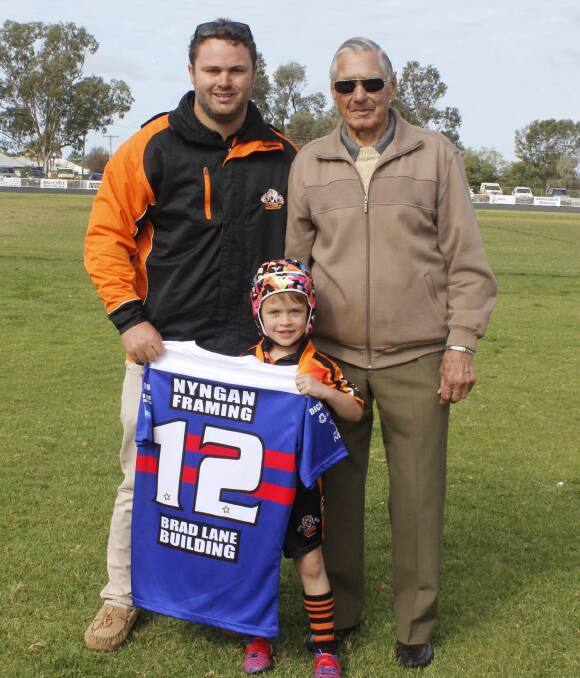 REPLICA JERSEY: Jacob Neill was presented with his jersey by grandfather Dick Wright, in between games on Sunday.  Dick played in the winning 1946 Nyngan team. Photo: CONTRIBUTED.