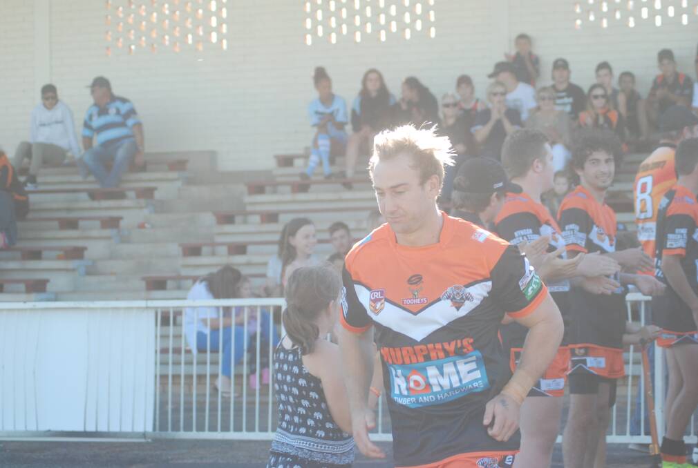 SENIOR SUPER TEAM: Stewart Mills leads the team out for his first game in the Tigers jersey. 