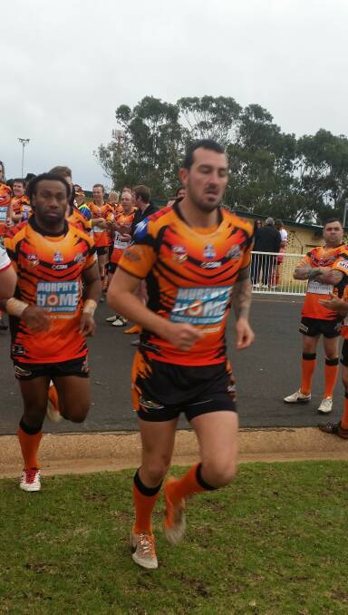 VICTORS: The Tigers first grade running out to Larkin Oval on Sunday to take down the Jets. Brad Pickering leads the team out.
Photo: CONTRIBUTED. 