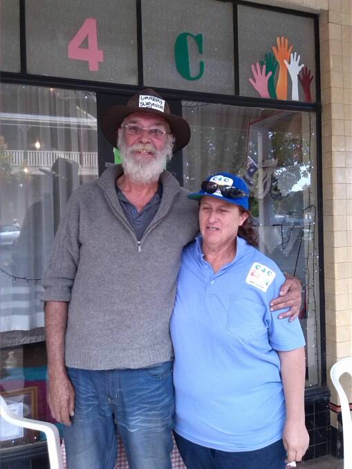 AT WORK: Bronwyn Drew of Caring for Coolah with Paul, a Sir Ivan fire survivor from the village of Uarby east of Dunedoo. Photo: CONTRIBUTED 