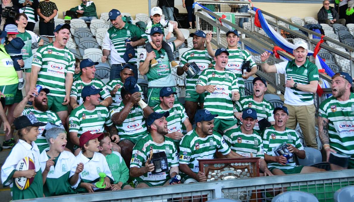 CELEBRATE: Dubbo players with the premiership silverware after Sunday's grand final win. Photo: BELINDA SOOLE