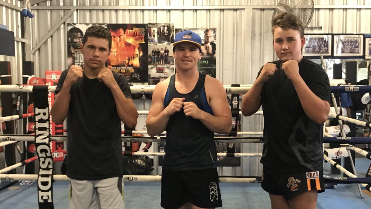 BOXING: James Fisk, Sonny Knight and Roy Calton at the shed getting ready for their fight in Bathurst on November 4. Photo: CONTRIBUTED