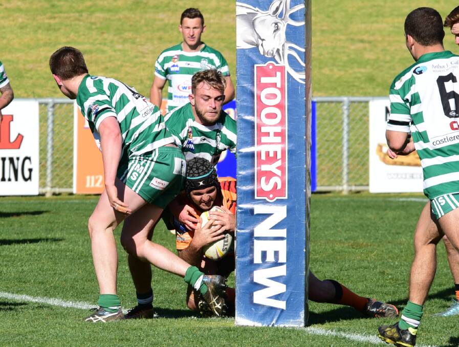 TRY TIME: Nyngan's Derek Knight goes over to score during his side's major semi-final loss to CYMS on Sunday. Photo: BELINDA SOOLE