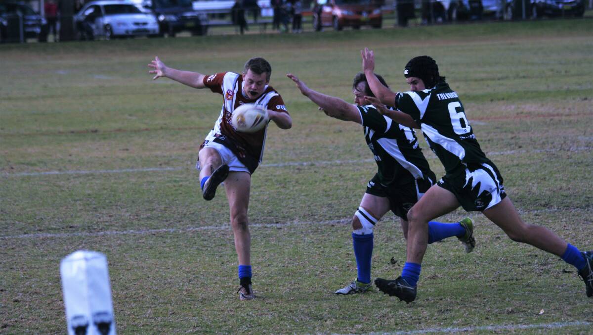 Evan Ryan clears the ball out of Gilgandra's defensive end in their 50 - 6 win over the Dunedoo Swans at the weekend. Photo: CONTRIBUTED