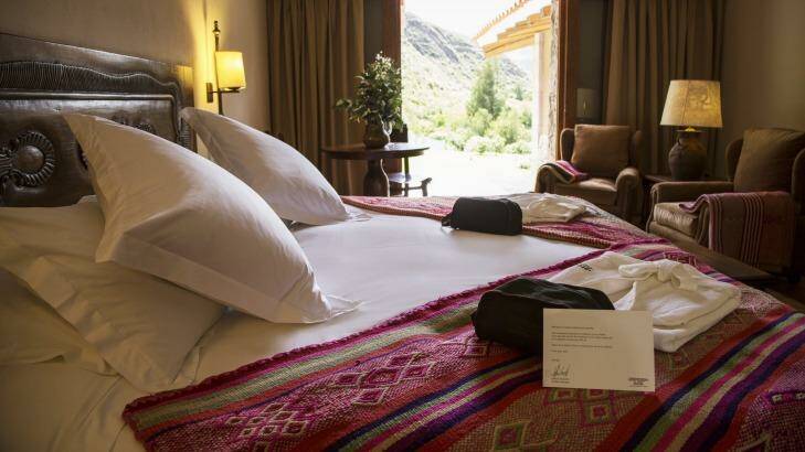 Rooms at the Inkaterra Hacienda Urubamba feature huge windows offering views of the Sacred Valley and surrounding mountains.
