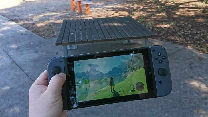 At 14mm thick and around 400 grams with the Joy-Con attached, the Switch is big but certainly portable.  Photo: Tim Biggs