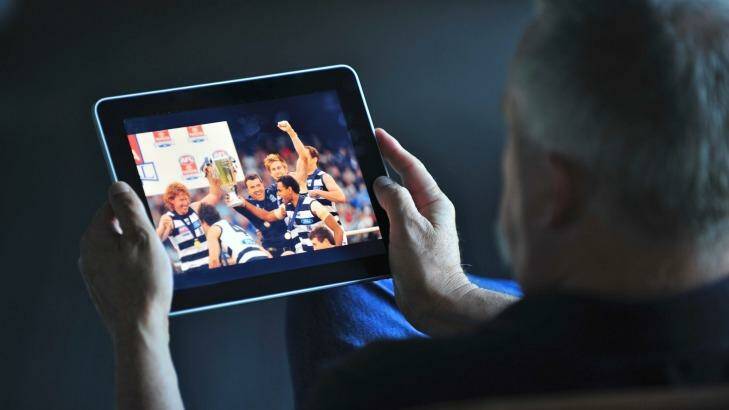 The Age News 1st February 2012 Picture Wayne Taylor Generic picture of a man watching AFL football on the ipad. Photo: Wayne Taylor