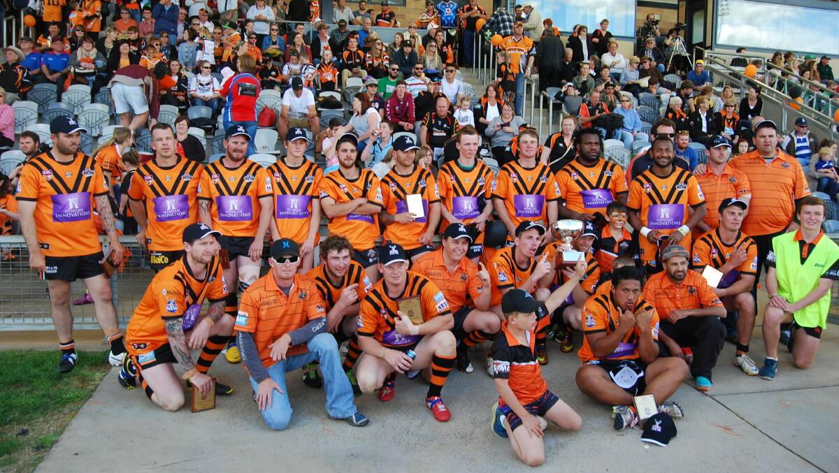 Nyngan Tigers’ Reserve Grade team with all their loyal supporters after winning the grand final against Dubbo CYMS, 22 to 20.