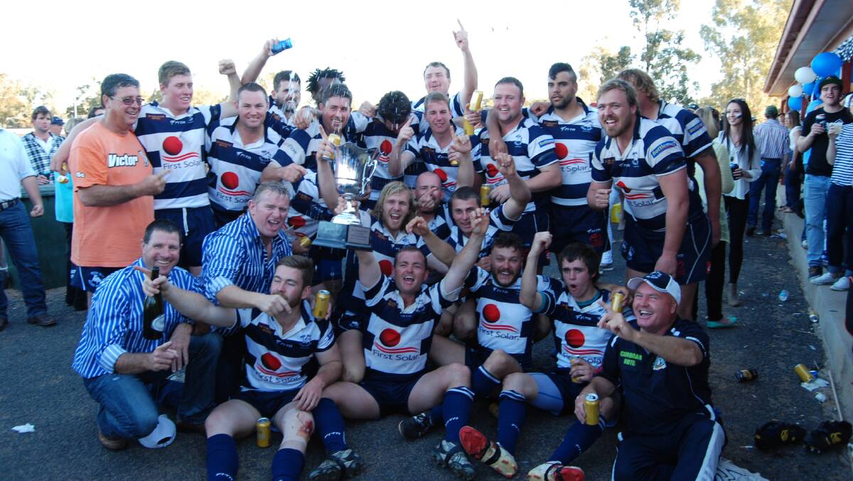 Winners are grinners. The Bogan Bulls celebrate after defeating the Warren Pumas in the Grand Final at Larkin Oval last Sunday.