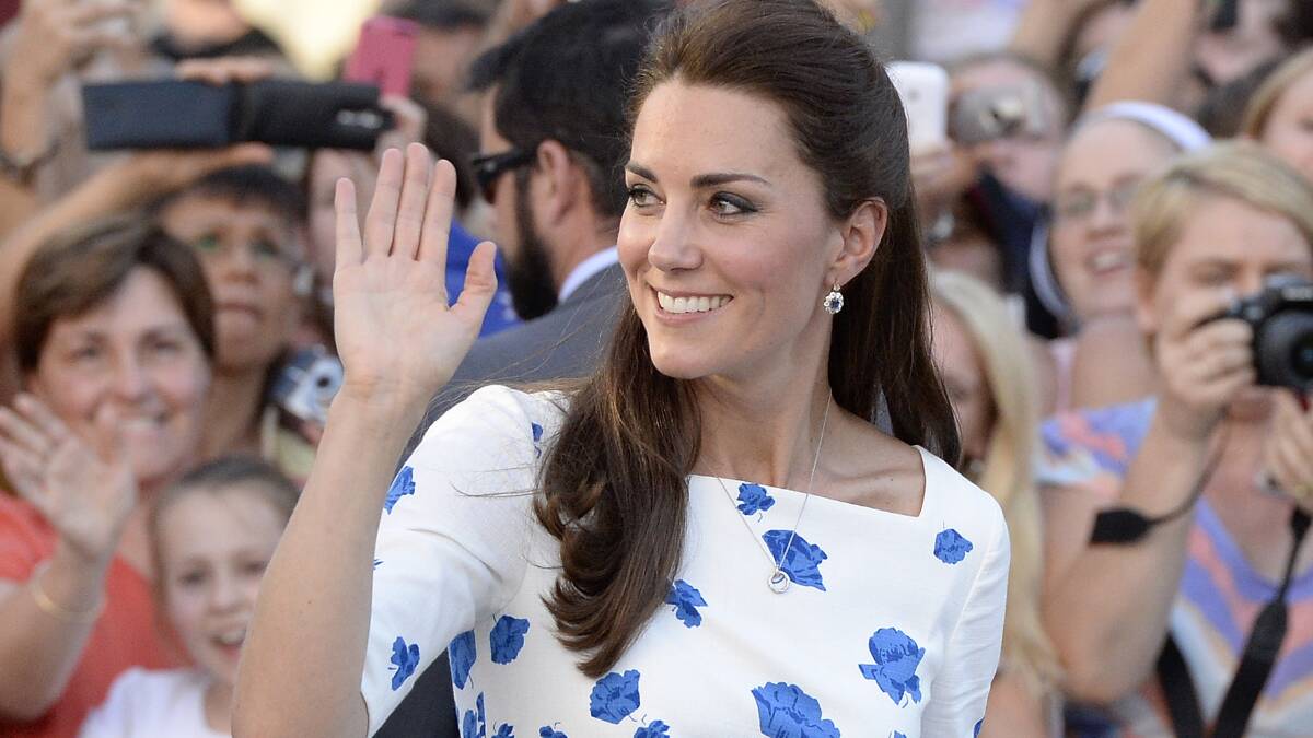  Catherine, Duchess of Cambridge waves to the crowd in  Brisbane, (Photo by Bradley Kanaris/Getty Images)