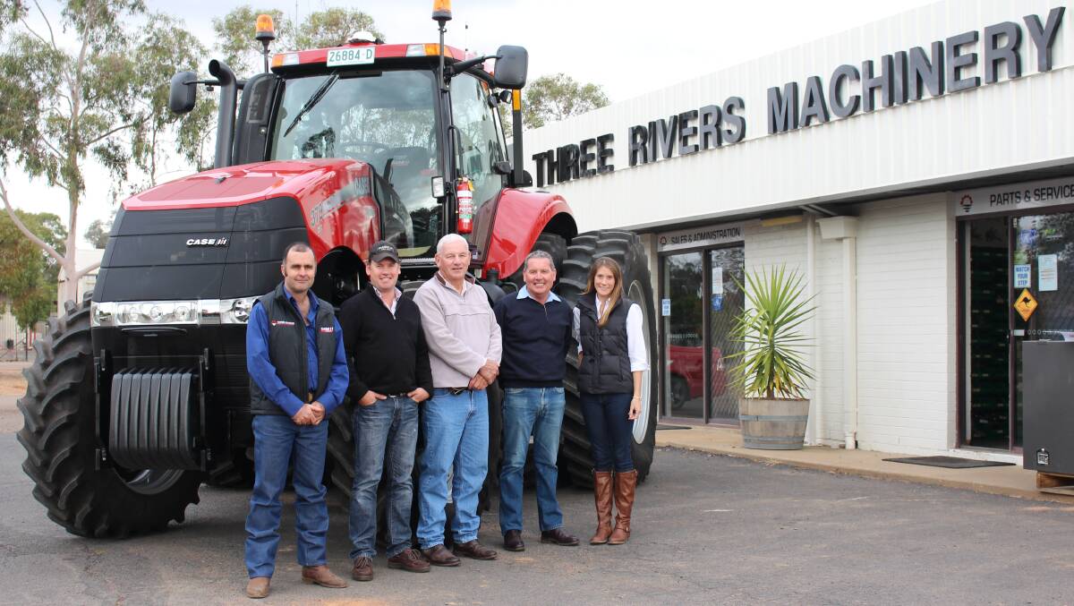 o Three Rivers Machinery sold the first Magnum 370 CVT in Australia to customers Steve, Mark and Thea Miller. PIctured are Three Rivers Machinery service manager Ray Watson with Geoff, Mark, Steve and Eleanor Miller.                                                                                                                                     Photo: WARREN WEEKLY