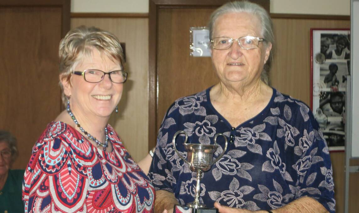 o Far West CWA Handicraft Officer Denise Turnbull presenting Bay Lovett with the Gladys Brooks Trophy for the Craft Bag Competition.
