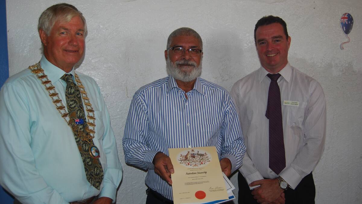 Mayor Ray Donald presented Mohammad Tariq Javaid Qureshi with his Australian Citizen certificate with Bogan Shire Council general manager Derek Francis.