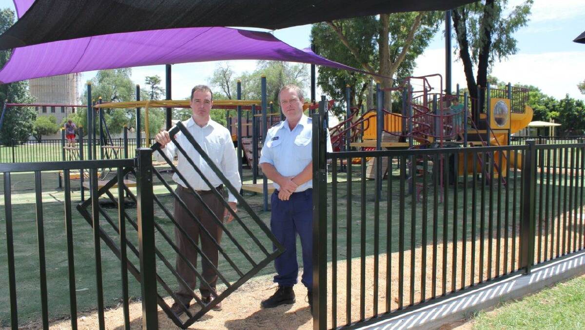 VANDALS:    Bogan Shire Council general manager Derek Francis and Sergeant Tony Wood form Nyngan Police inspect the vandalism caused in Nyngan recently. It’s hard to see what pleasure anyone could get out of committing these crimes. 