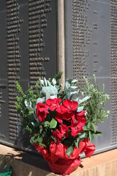 Flowers placed at Nyngan’s war memorial to honour its fallen.
