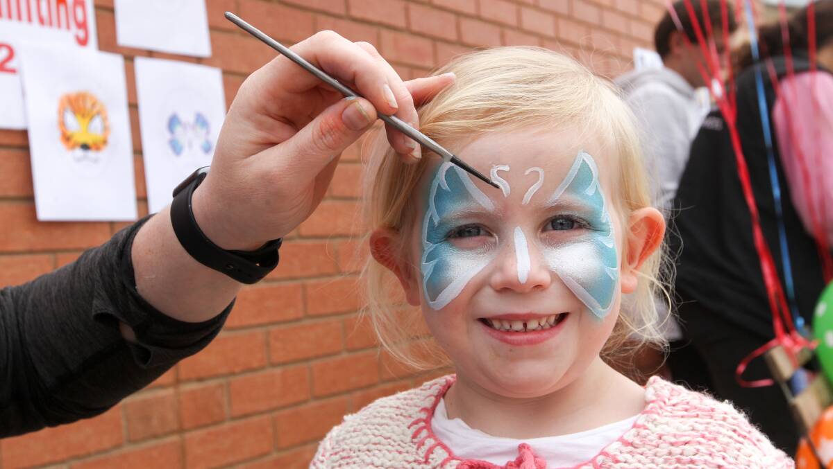 PAINTING: Ava Ryan has her face painted. It was one of several activities at the event to raise funds for the four children. Picture: Blair Thomson