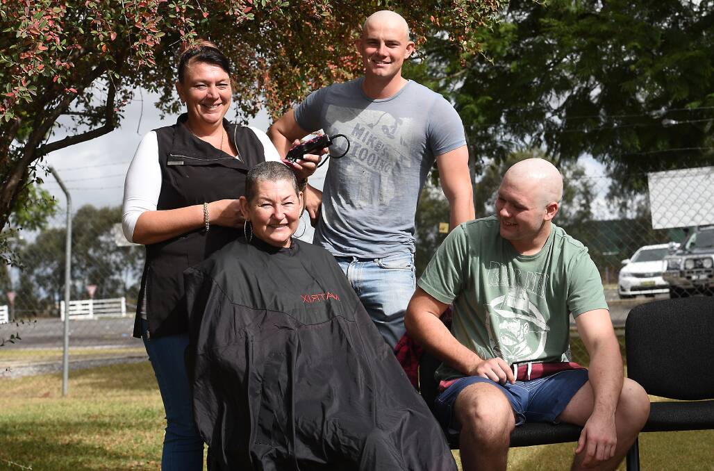UNDER THE SCISSORS: Kellee Mitchel, Michele McInerney, Andrew Galvin and Konner Bird shave their heads for charity, Where There's A Will. Picture: Gareth Gardner 