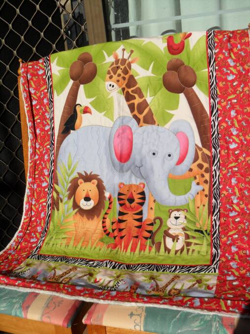 o One of the beautiful baby cot quilts.