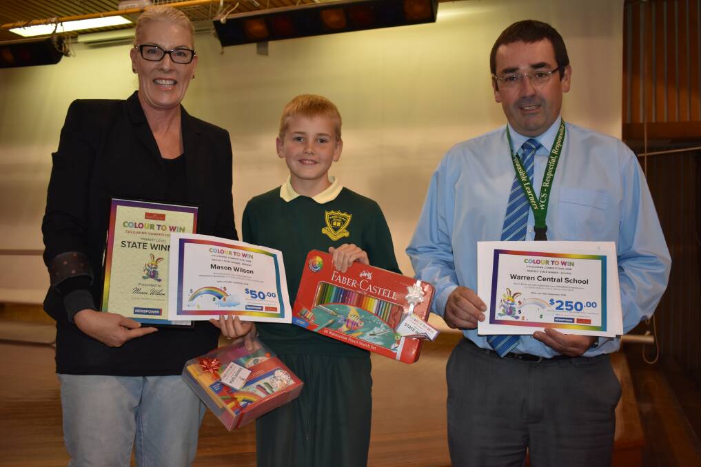 Colouring In: Mason Wilson, Mrs Merryn Quigley from Grindrod's Newsagency and Principal Mr Duncan Lovelock.