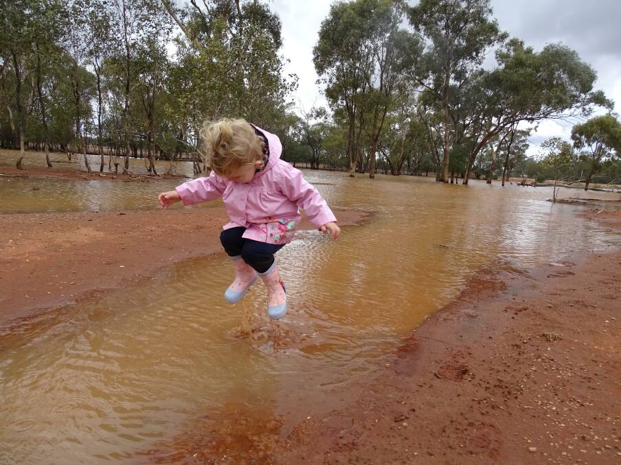 SPLASHIN' AROUND: Three year old Matilda Bright enjoyed jumping in muddy puddles at her family property. Photo: DIONE BRIGHT