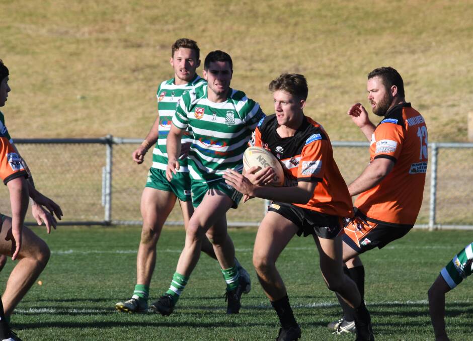 ROARING: Club standout Jak Jeffery makes his way into CYMS defence. Photos: AMY McINTYRE