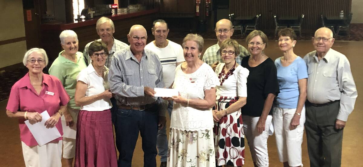 TWO STEP: The Social Dance Group presents their donation to Vice President Betsy Donohoe and Secretary Mary Lamph from the Hospital Auxiliary. Photo: ZAARKACHA MARLAN