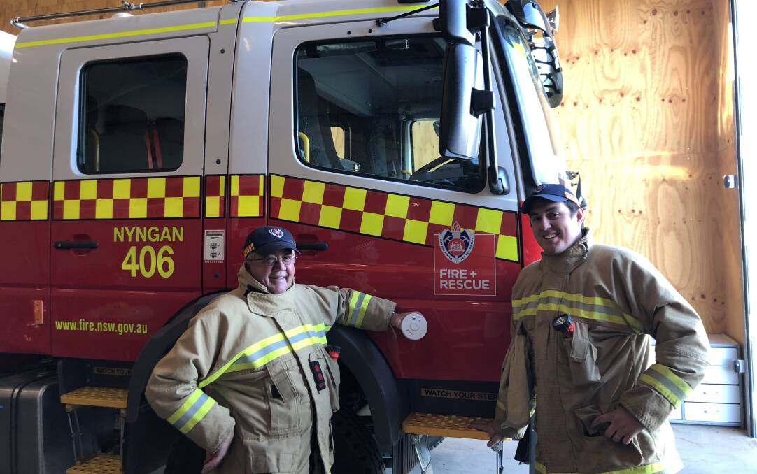 CHECK SMOKE ALARMS: Nyngan Fire and Rescue Captain Rob Avard and retained firefighter Jordan Lane are encouraging residents to check their smoke alarms. Photo: ZAARKACHA MARLAN