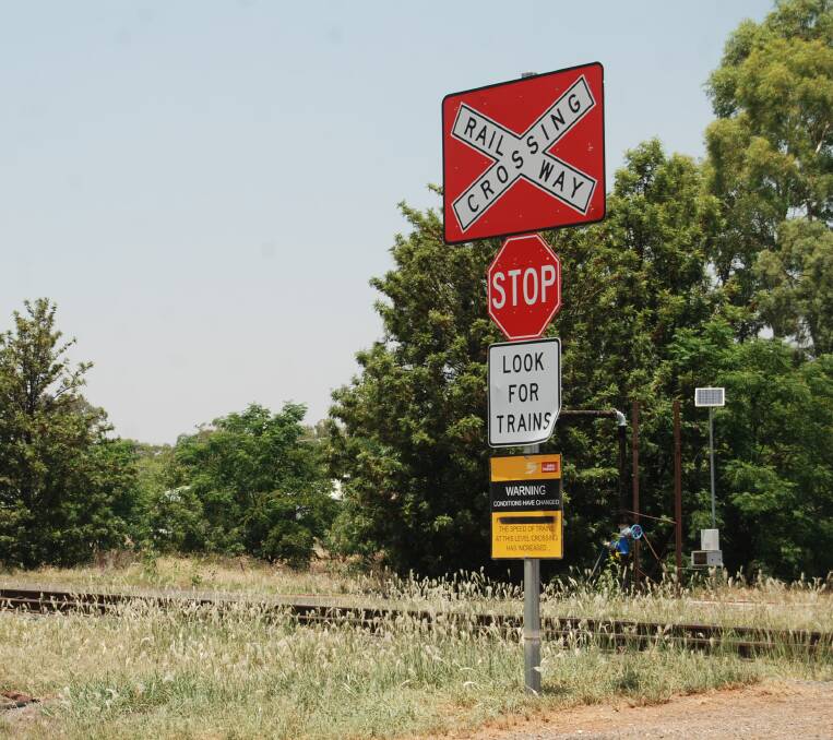 WARNING: The sign on Hoskins Street warning road users of changes to train speeds. Photo: ZAARKACHA MARLAN
