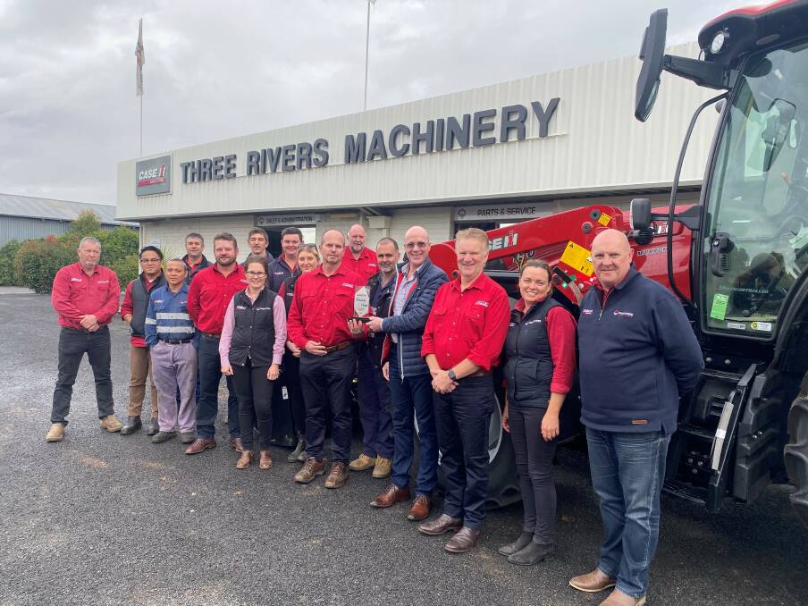 Some of the Three Rivers Machinery team at the Warren branch celebrate the win with representatives of Case IH. Photo: CONTRIBUTED 