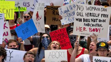 Abortion rights protesters chant on the steps of the Alabama state capitol building during a rally and march on the capitol in Montgomery on Sunday, June 26. Photo: Mickey Welsh-USA TODAY NETWORK/Sipa USA /AAP Image