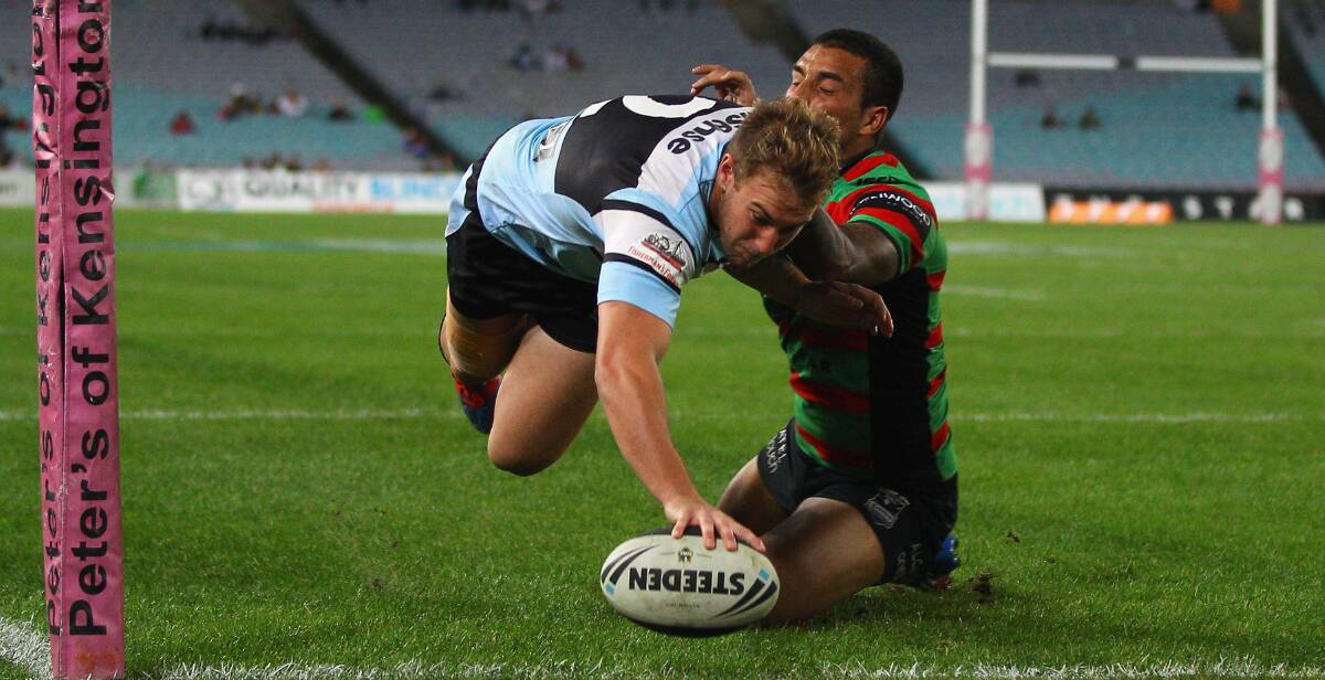 RECRUITED: Stewart Mills, pictured scoring a try during his time with the Cronulla Sharks, has been signed by the Nyngan Tigers in of the biggest moves of the Group 11 off-season. Photo: GETTY IMAGES