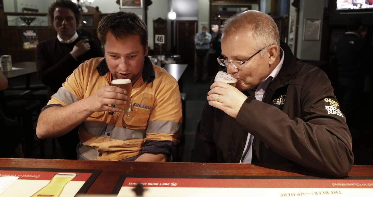I'd love to have a beer with ScoMo: Prime Minister Scott Morrison meets locals at Molly Malone's Irish Pub in Devonport, Tasmania on Wednesday, April 17. There's been lots of froth and bubble during the election campaign but not much of substance. Photo: AAP