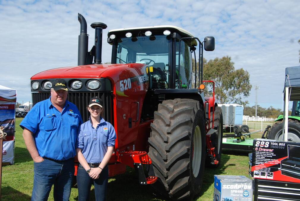 Western Farm Machinery's Mick Carey and Jane Carey exhibit their tractors at a previous Nyngan Ag Expo.