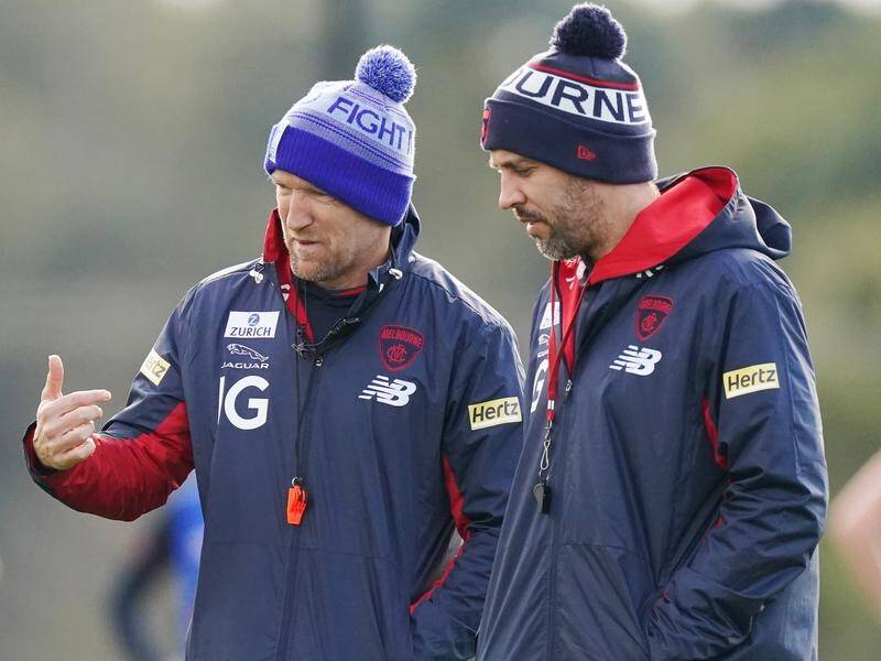 Melbourne are depending on fitness guru Darren Burgess (l) to get them through a busy AFL schedule.