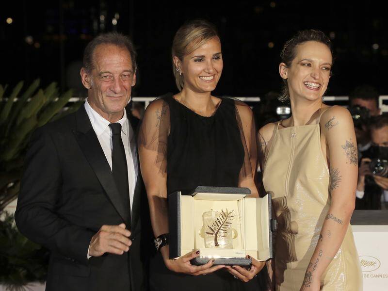 Julia Ducournau, centrem has won the Palme d'Or for the film 'Titane' at the Cannes Film Festival.