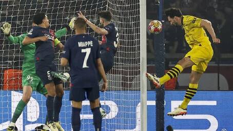 Dortmund's Mats Hummels (right) scored the decisive goal in the Champions League semi against PSG. (EPA PHOTO)