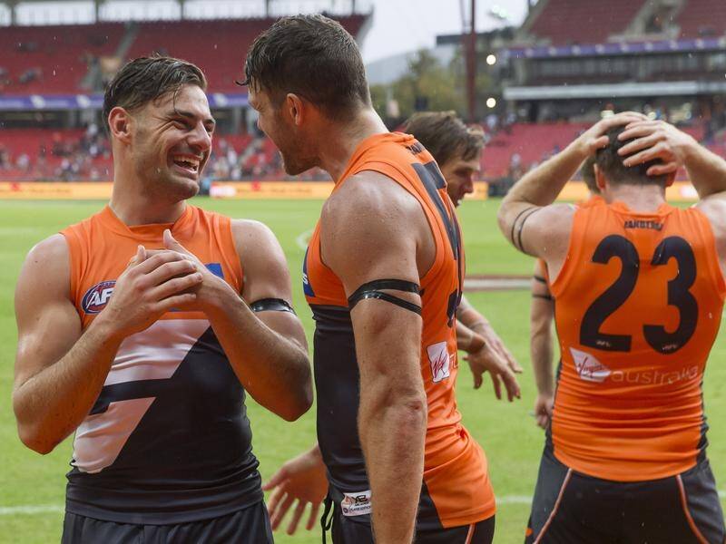 Star GWS midfielder Steve Coniglio (L) is unsure on when he will decide on his next AFL contract.
