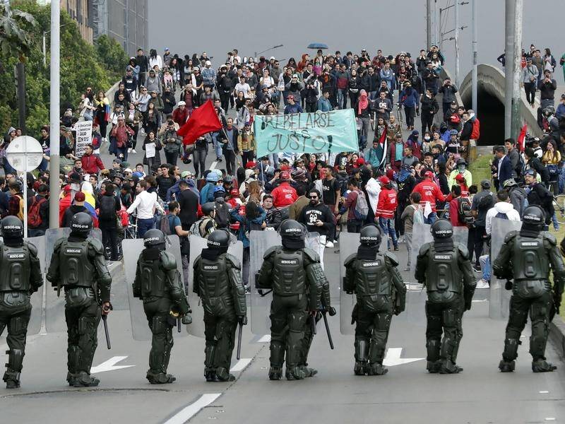Riot police block protesters in Bogota, Colombia.