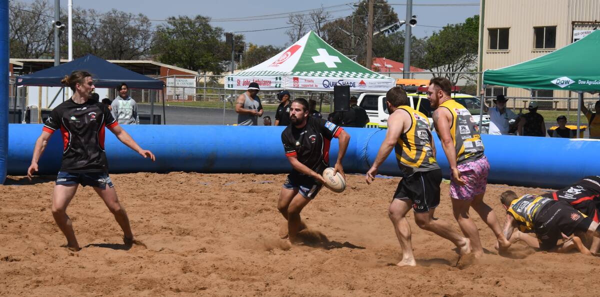 Narromine's Ryan Wheeler playing beach rugby.
