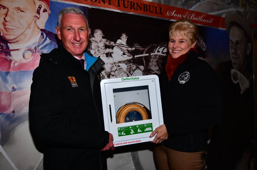 LIFE SAVING: Bathurst Harness Racing chief executive officer Danny Dwyer and sponsorship and marketing manager Marianne Donnelly with their newly-purchased defibrillator. Photo: ALEX GRANT